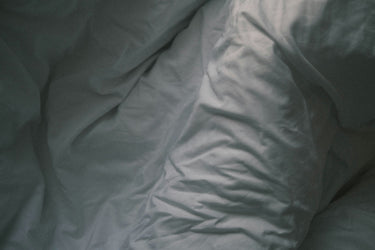 What Your Sleeping Position Says About Your Pain—And How to Fix It